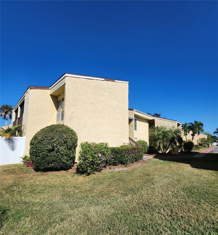 3415 Clark Road, Unit 215 Sarasota, FL 34231 - Photo 2 of 18 a view of a back yard