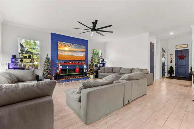 a living room with furniture and a flat screen tv