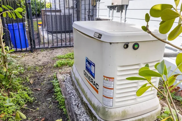 a view of a balcony with chairs and a potted plant