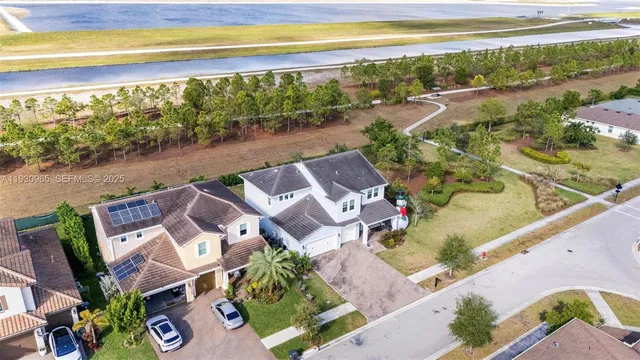 an aerial view of a house with a yard