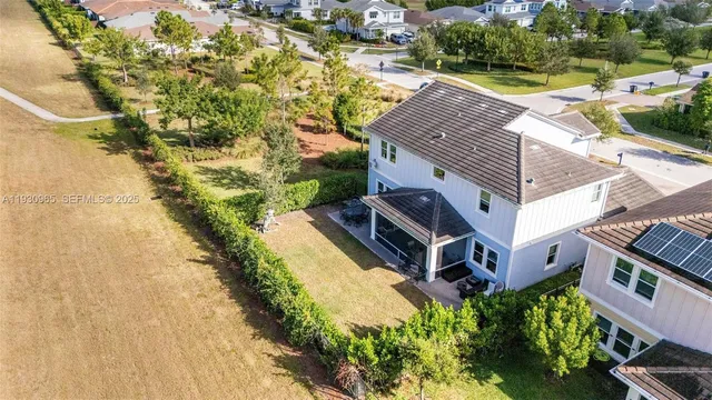 a view of house with swimming pool and furniture