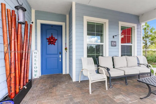 a living room filled with furniture and a window