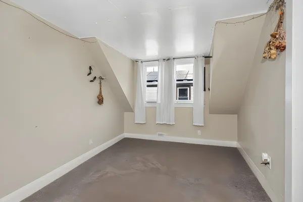 a view of a hallway with staircase