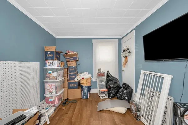 a bed room with a bed and a flat screen tv