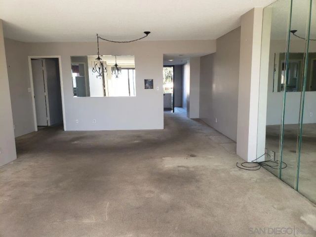 a view of empty room with floor to ceiling window