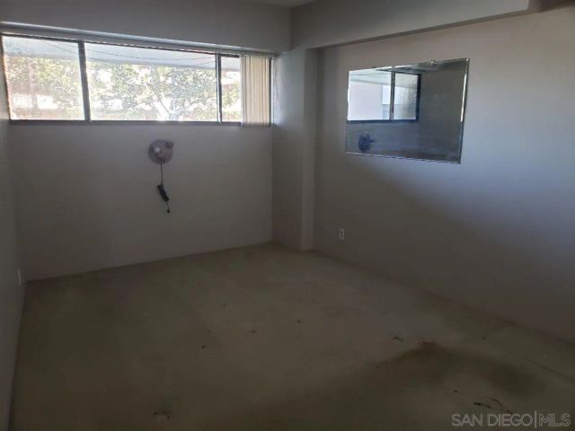 a bathroom with a toilet a sink and a mirror