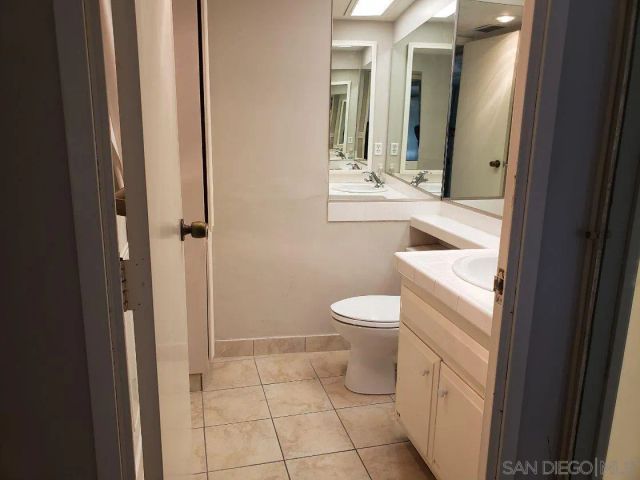 a bathroom with a toilet sink and shower