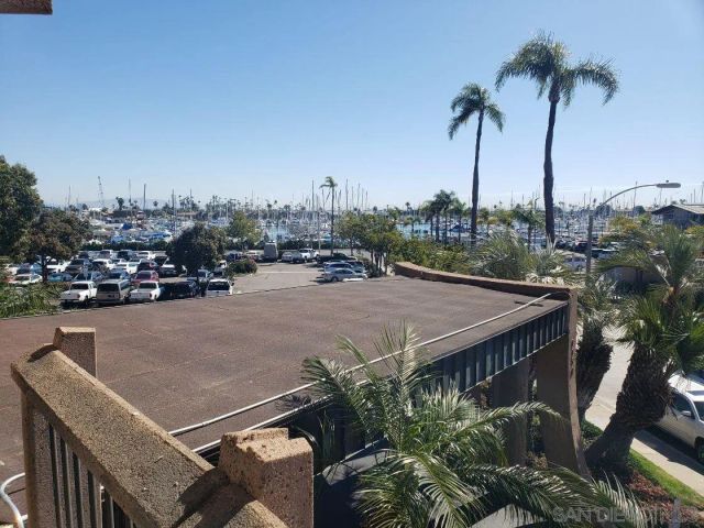 a terrace with outdoor seating and city view