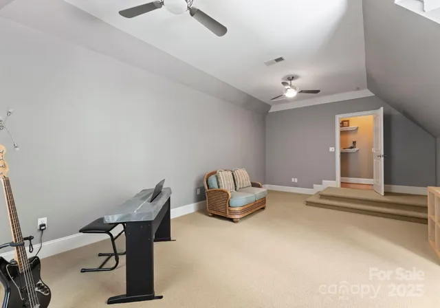 a room with gym equipment and view of living room