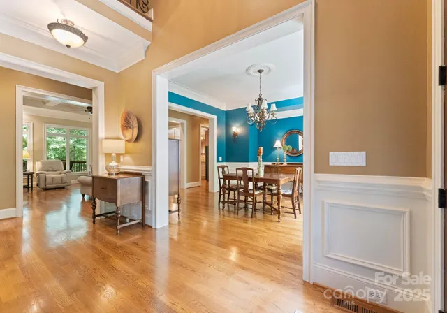 a view of a livingroom with furniture and a floor to ceiling window