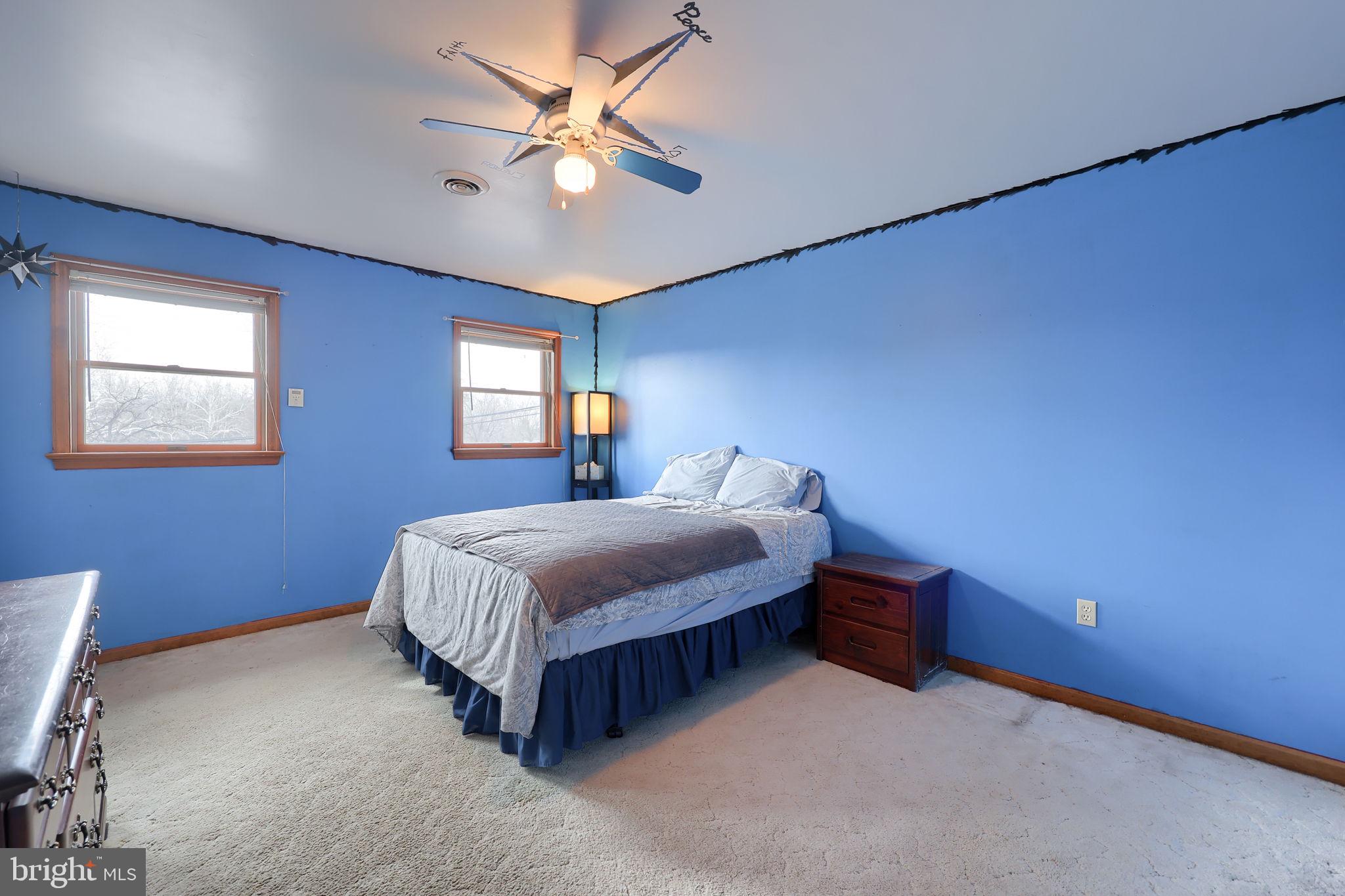 291 Bushong Road Leola, PA 17540 - Photo 35 of 81 a bedroom with a bed chandelier and a window