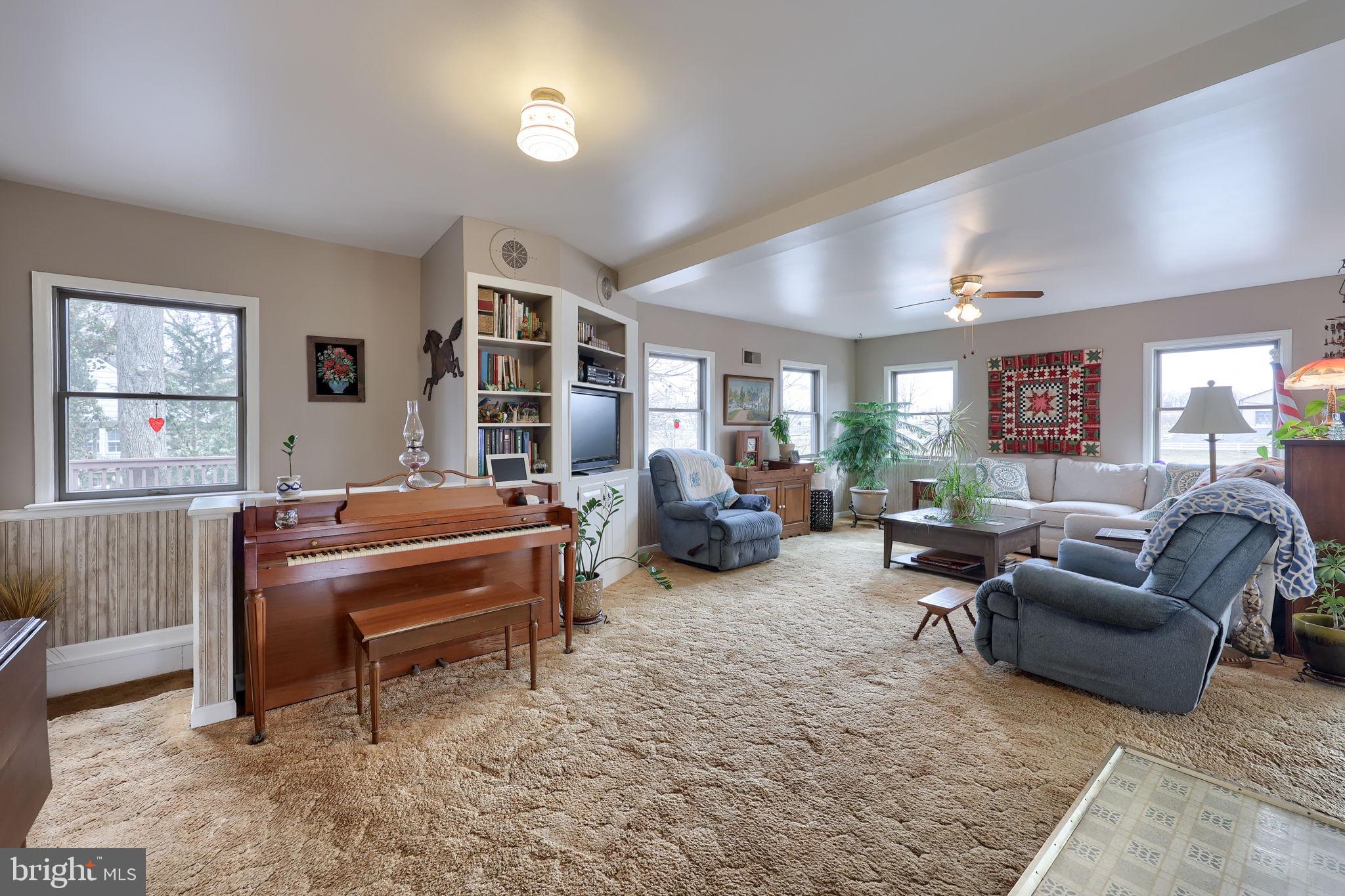 291 Bushong Road Leola, PA 17540 - Photo 6 of 81 a living room with furniture gym equipment and a window