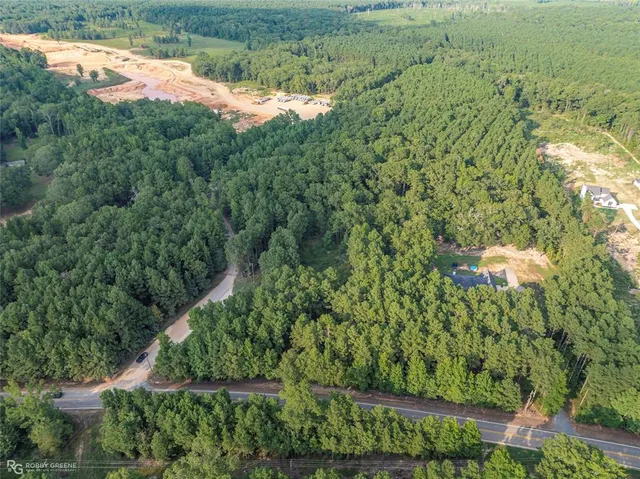 a view of a field with an ocean view