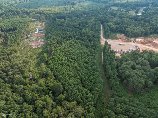 a aerial view of a house with a yard