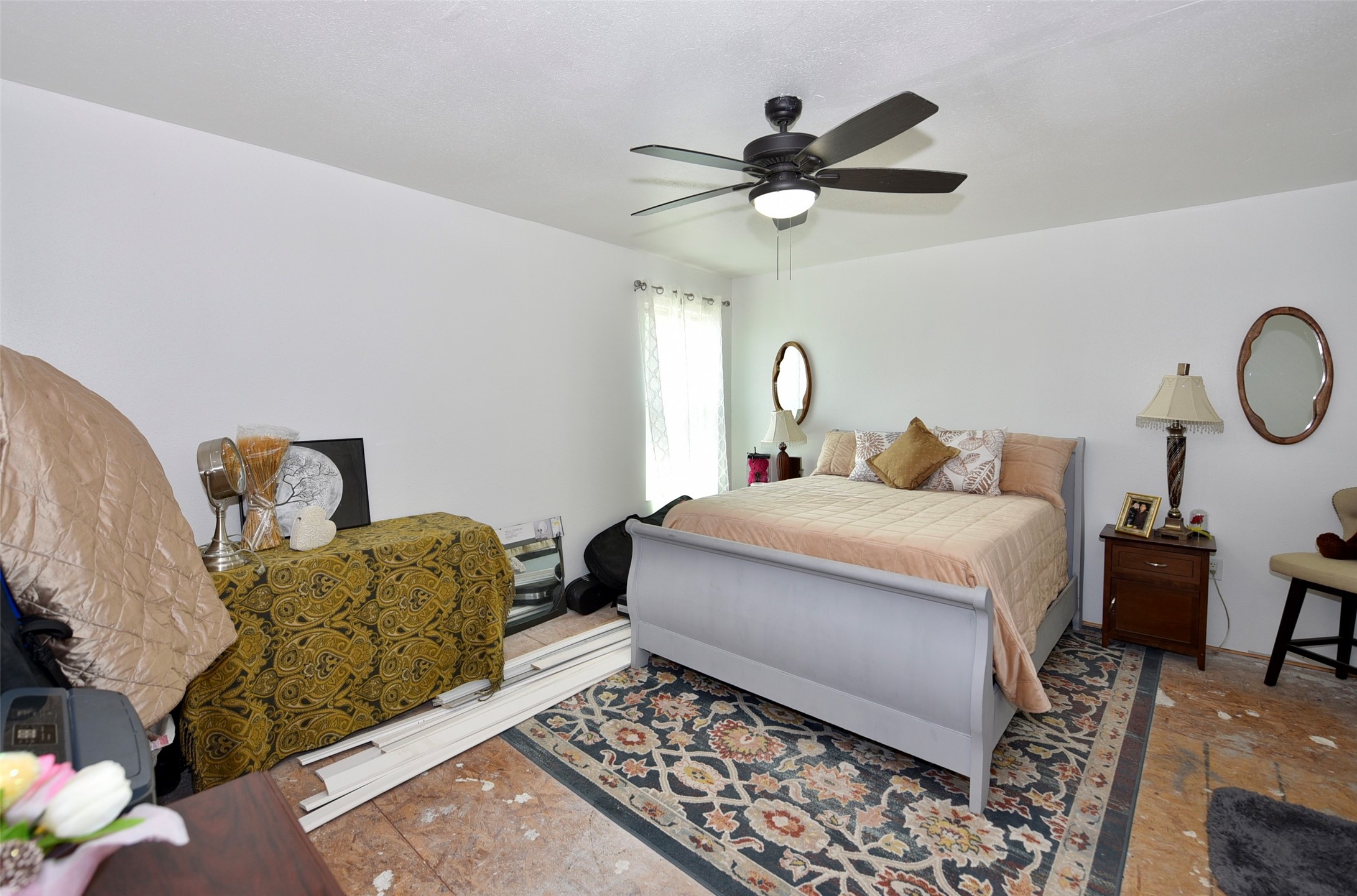 382 Road 5251 Cleveland, TX 77327 - Photo 19 of 22 Spacious second room with natural light, perfect for relaxation or a home office.