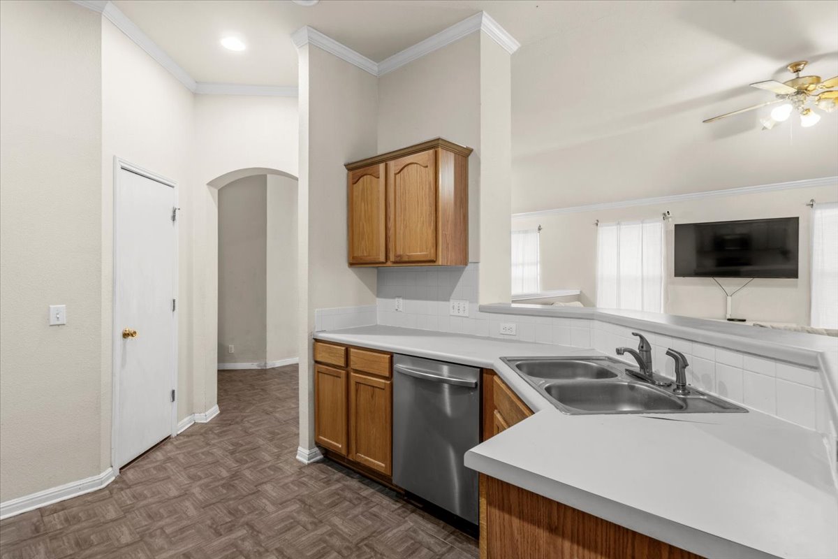 281 Leonardo Kyle, TX 78640 - Photo 11 of 38 a view of a kitchen with a sink and a refrigerator