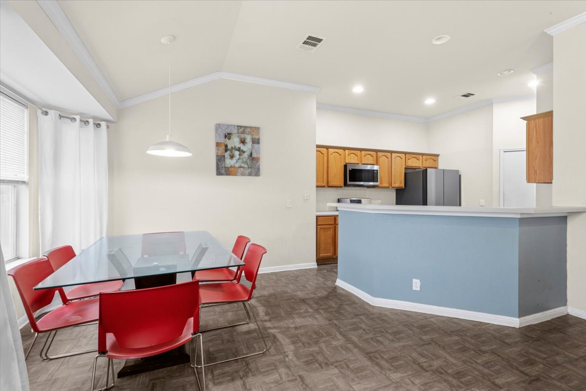 281 Leonardo Kyle, TX 78640 - Photo 14 of 38 a living room with furniture a flat screen tv and kitchen view