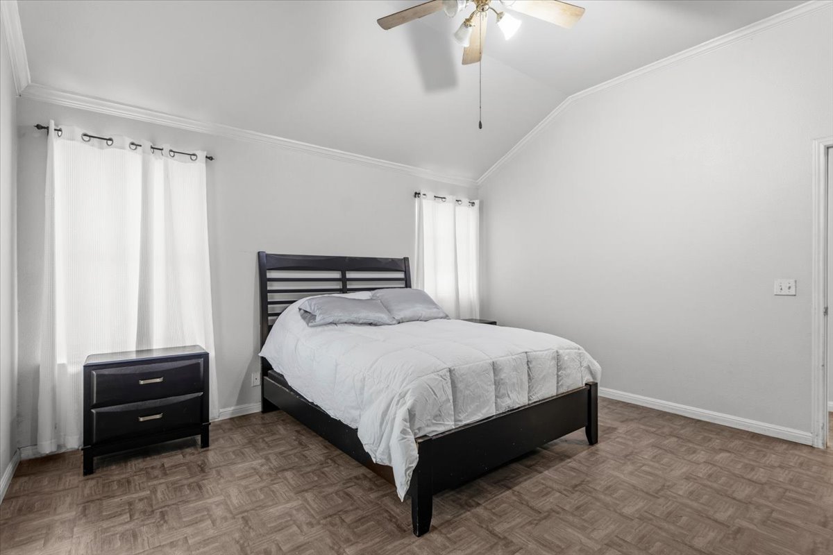 281 Leonardo Kyle, TX 78640 - Photo 23 of 38 a bedroom with a bed and a chandelier