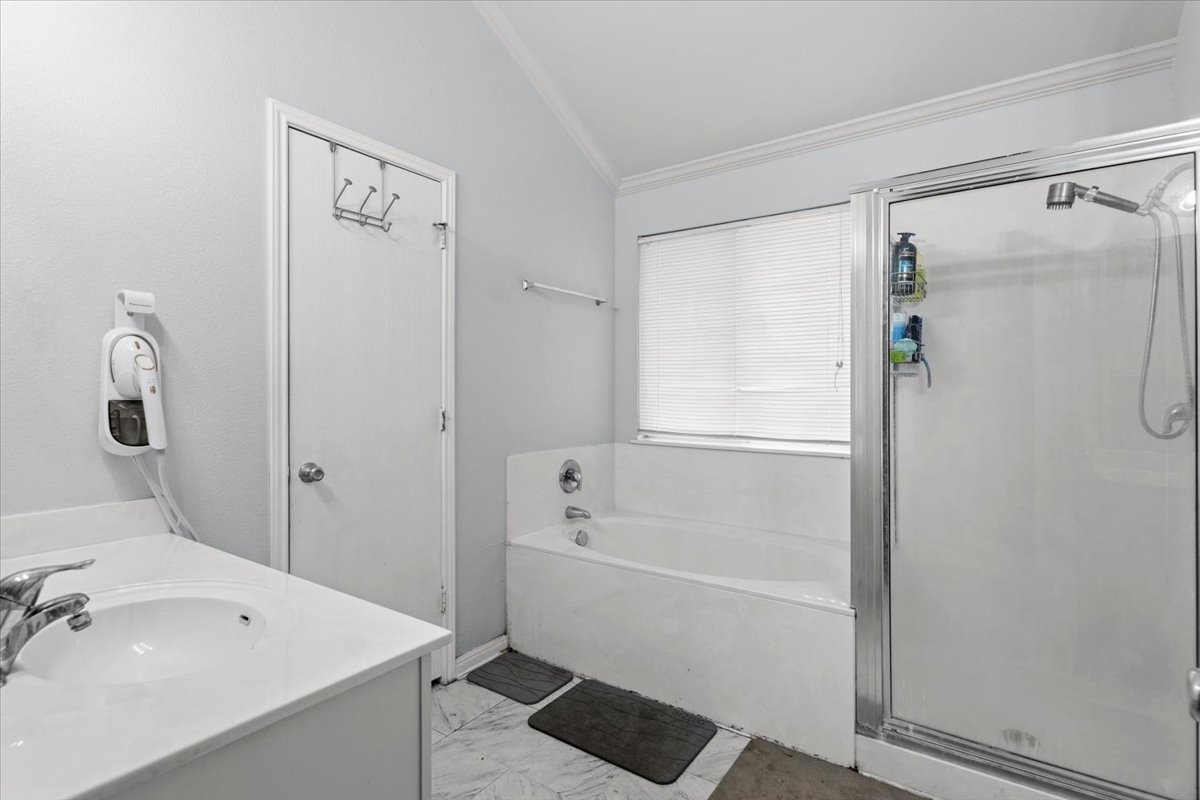 281 Leonardo Kyle, TX 78640 - Photo 25 of 38 a bathroom with a tub a sink and a shower