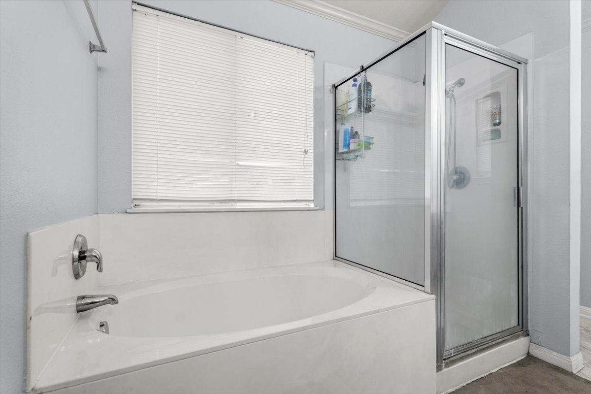 281 Leonardo Kyle, TX 78640 - Photo 28 of 38 a white bath tub sitting next to a shower