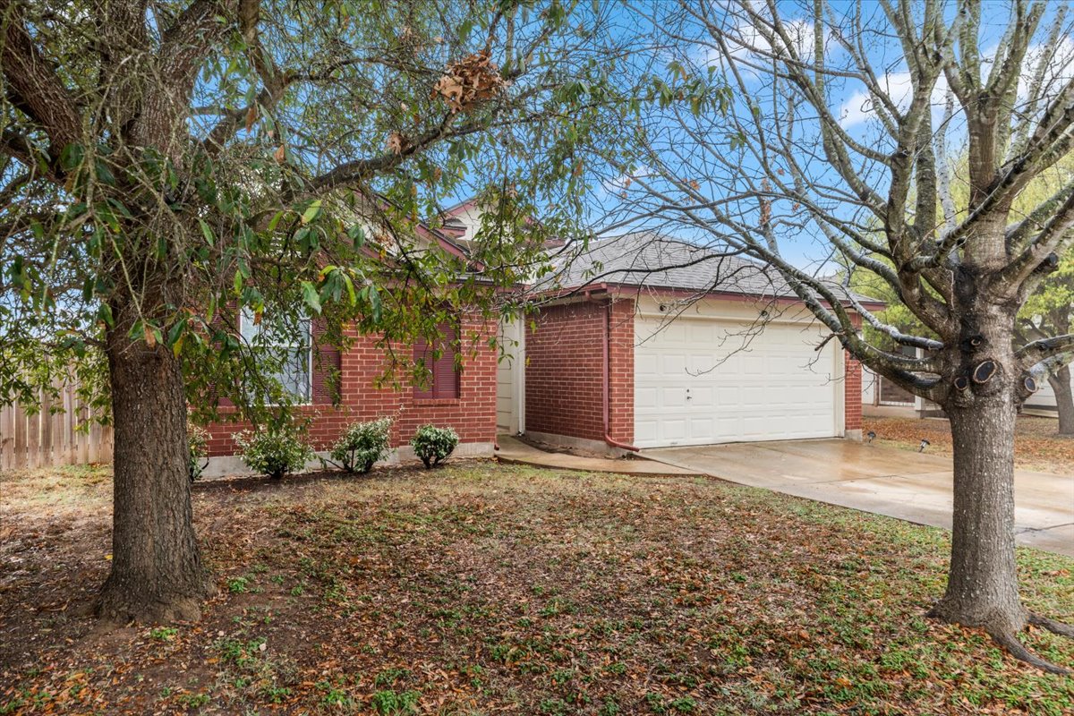 281 Leonardo Kyle, TX 78640 - Photo 3 of 38 a front view of a house with a yard