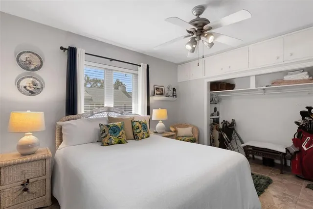 a bedroom with bed and a bookshelf