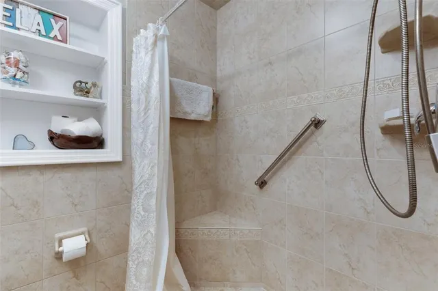 a bathroom with a toilet sink double vanity and mirror