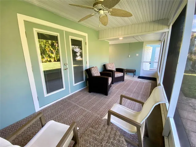 an aerial view of residential building with outdoor space and trees