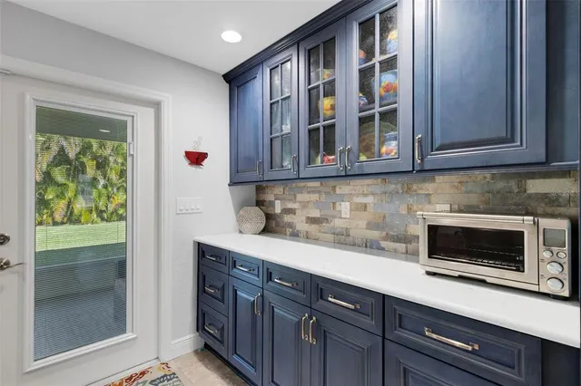 a living room with furniture ceiling fan and a rug
