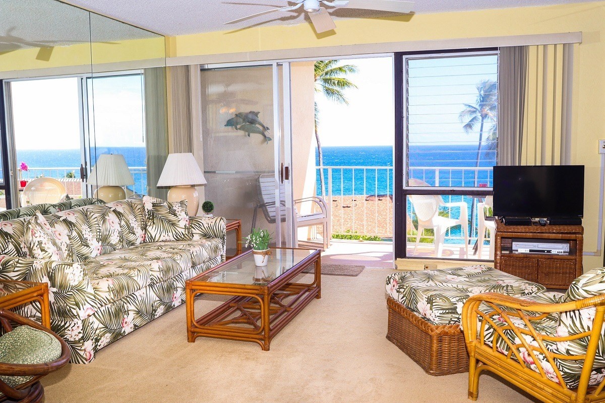 1763 Pe'e Road, Unit 305 Koloa, HI 96756 - Photo 2 of 14 a living room with furniture and a flat screen tv