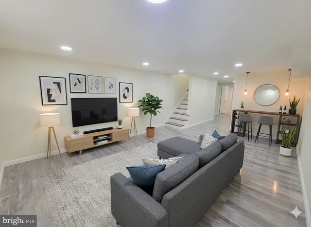 a bedroom with a bed and a potted plant