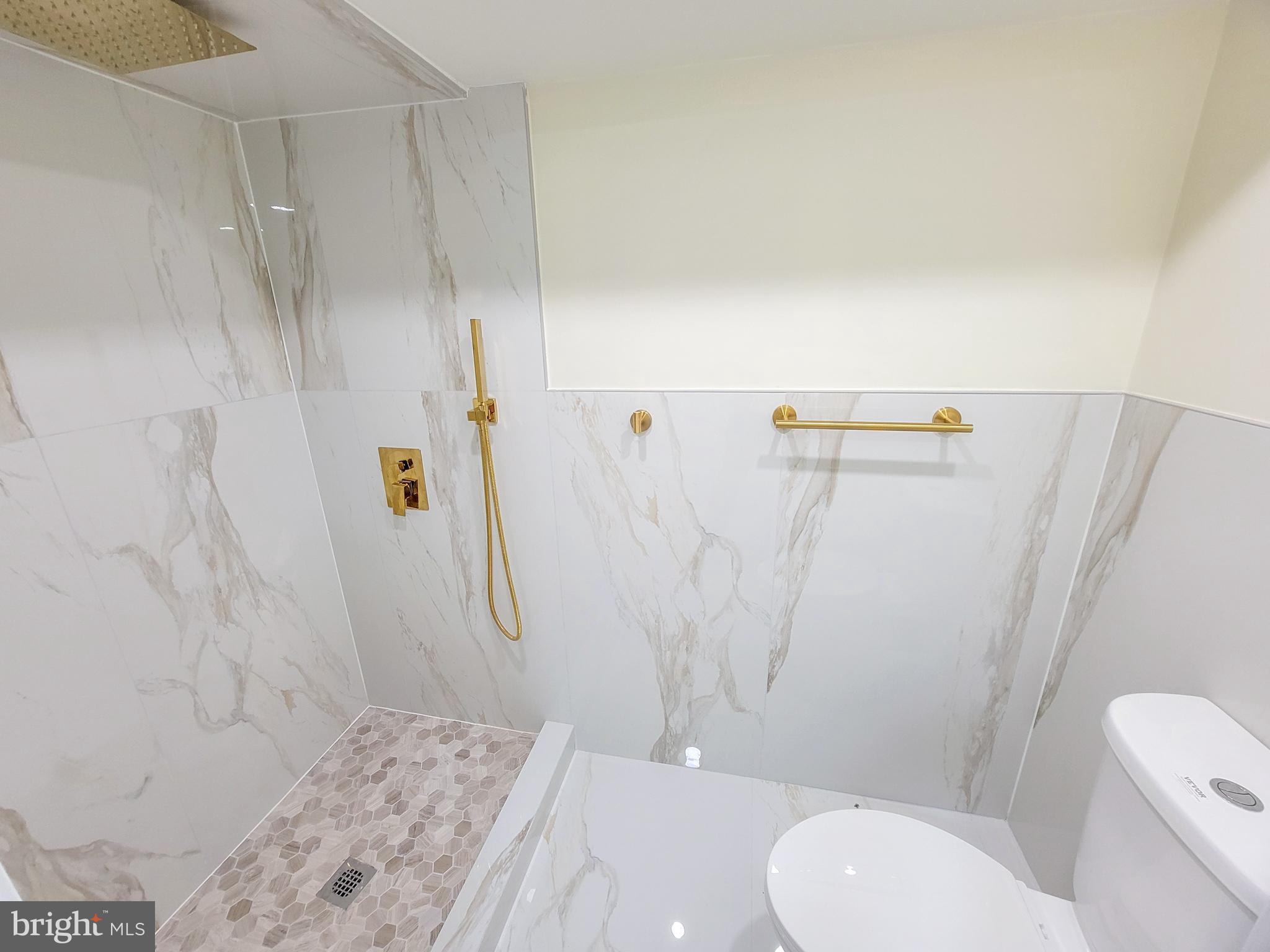 5502 Master Street Philadelphia, PA 19131 - Photo 18 of 63 a bathroom with a granite countertop sink toilet and shower