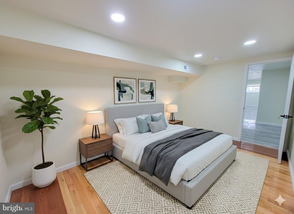 5502 Master Street Philadelphia, PA 19131 - Photo 19 of 63 a bedroom with a bed and a potted plant