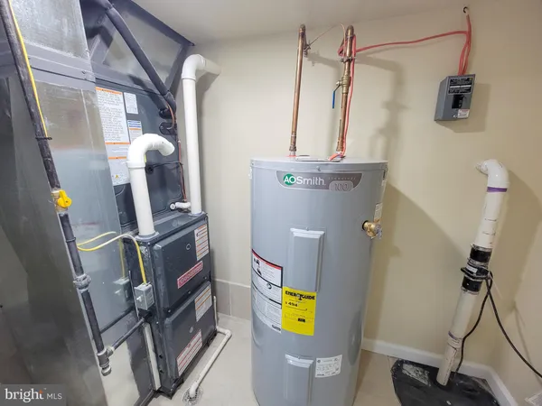 a view of a lobby area with wooden floor