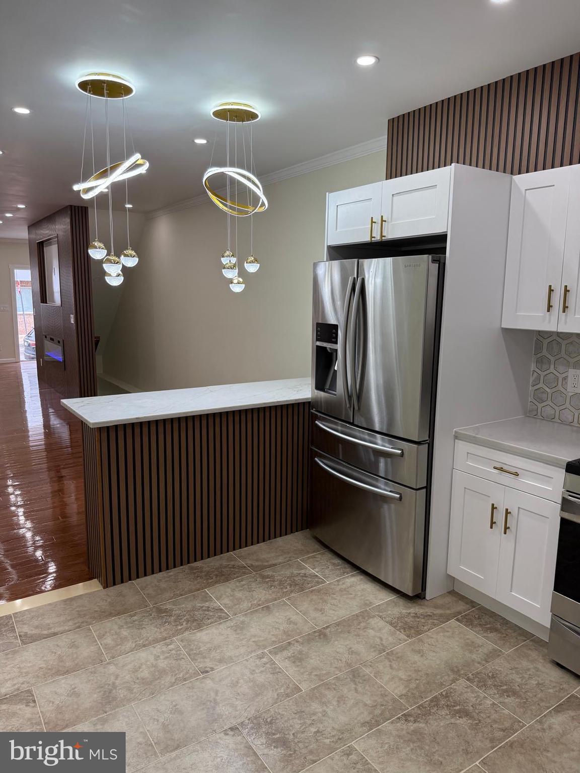 5502 Master Street Philadelphia, PA 19131 - Photo 28 of 63 a kitchen with cabinets and stainless steel appliances