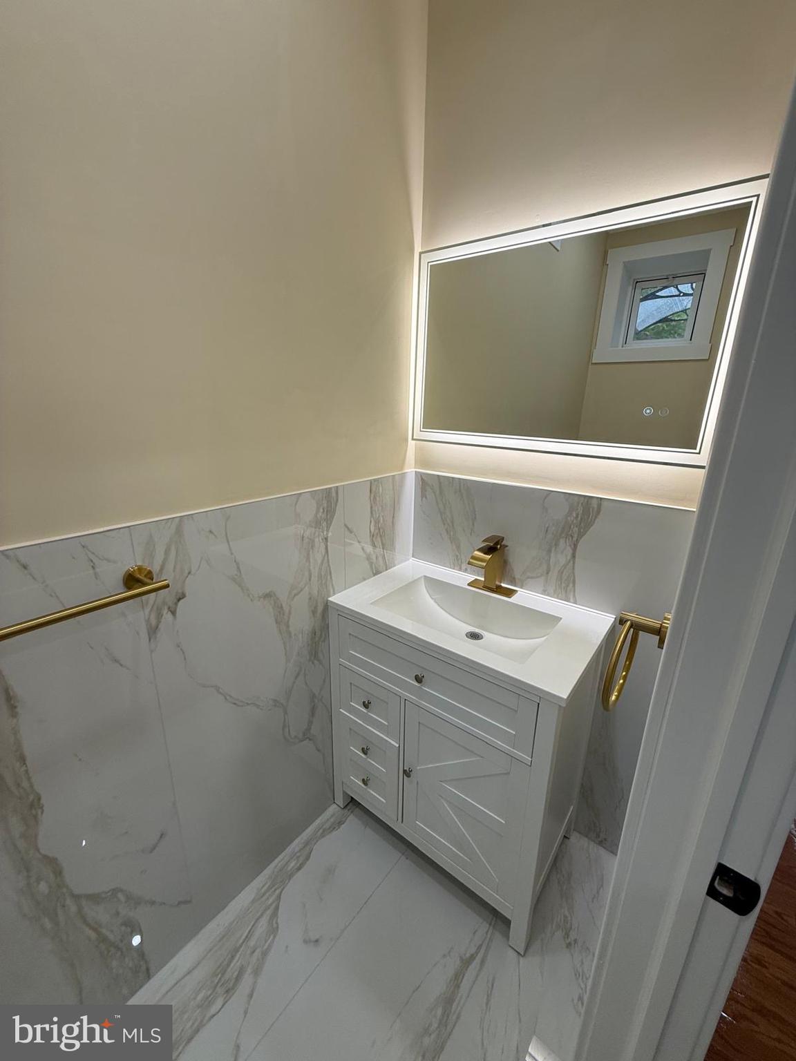 5502 Master Street Philadelphia, PA 19131 - Photo 35 of 63 a bathroom with a sink and a mirror