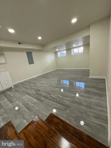 a view of an empty room and wooden floor