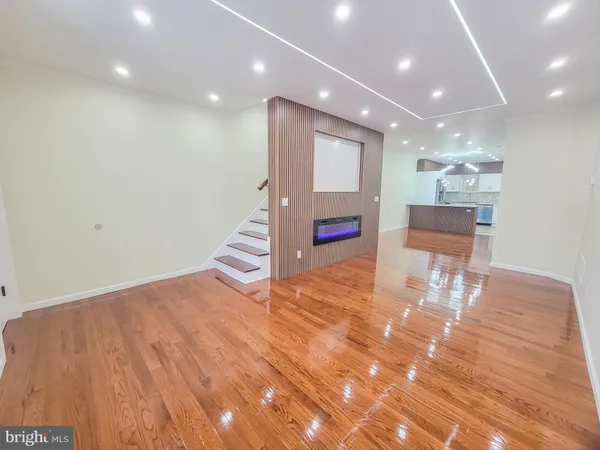a kitchen with stainless steel appliances granite countertop a refrigerator sink and cabinets