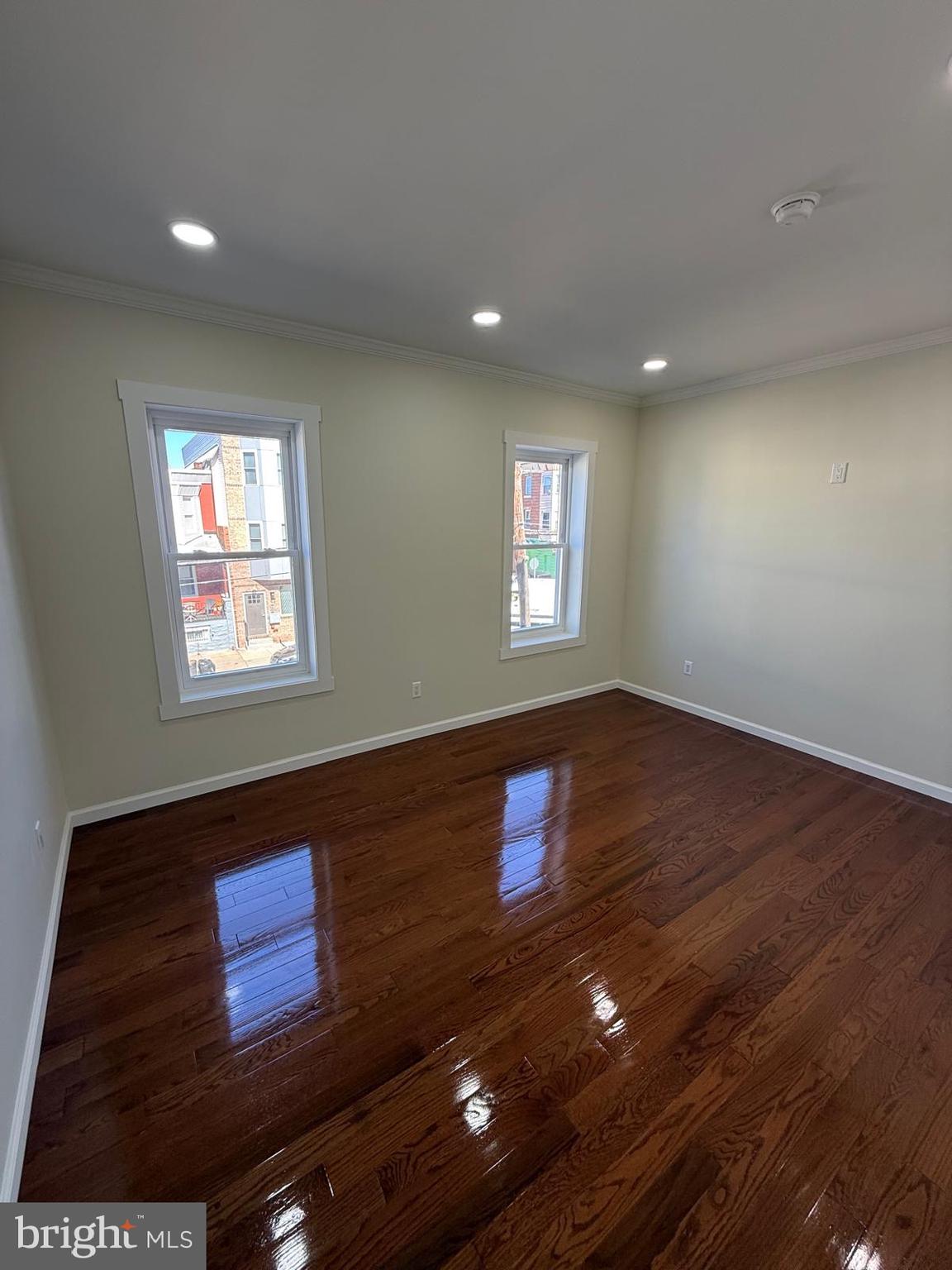 5502 Master Street Philadelphia, PA 19131 - Photo 52 of 63 a view of an empty room with wooden floor and a window