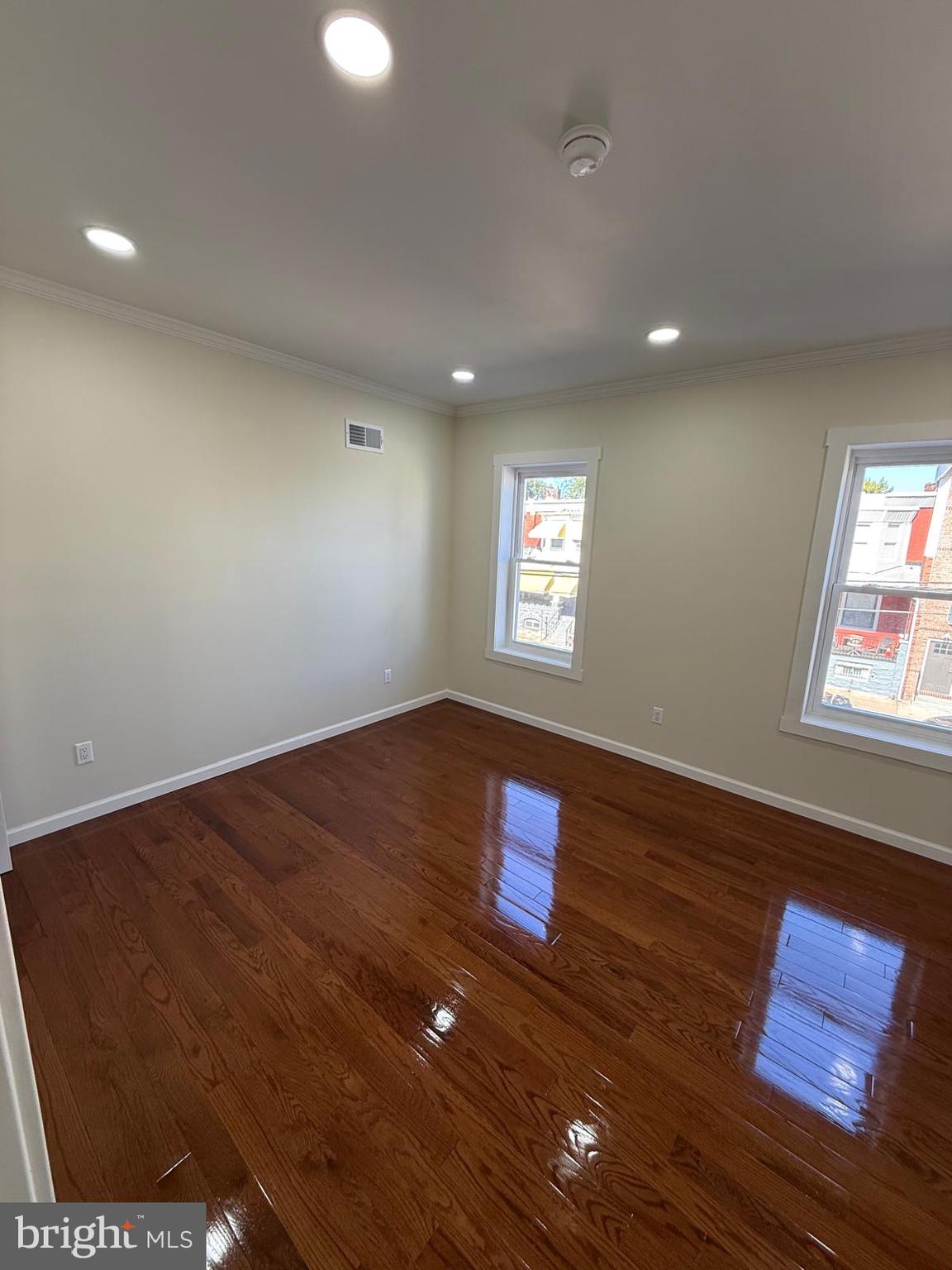 5502 Master Street Philadelphia, PA 19131 - Photo 54 of 63 a view of an empty room with window and wooden floor