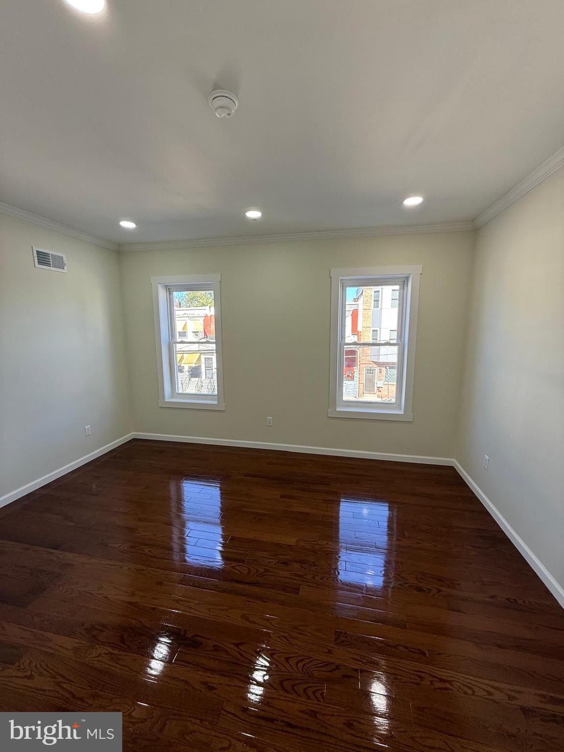 5502 Master Street Philadelphia, PA 19131 - Photo 55 of 63 a view of an empty room with wooden floor and a window