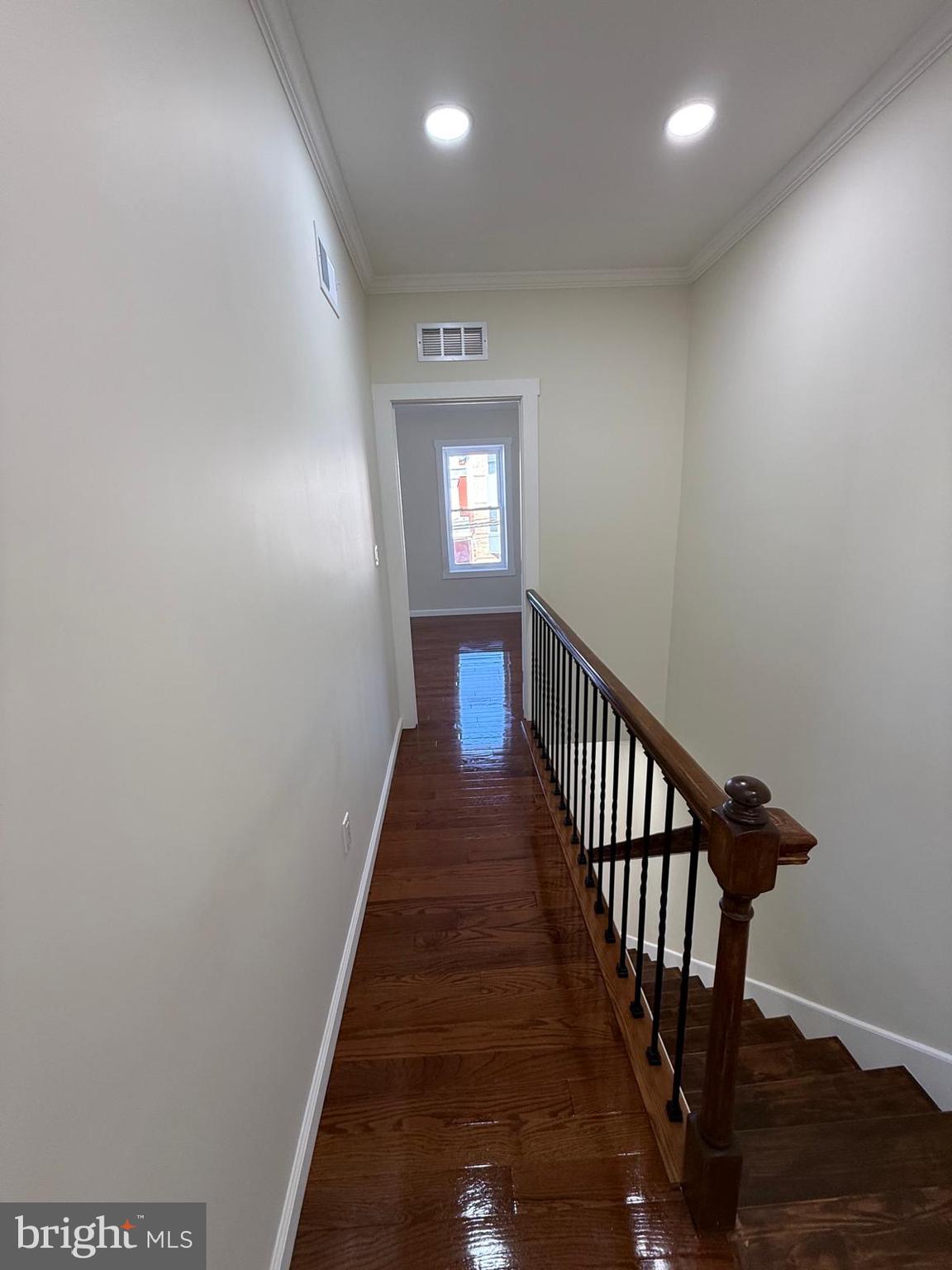 5502 Master Street Philadelphia, PA 19131 - Photo 57 of 63 a view of a hallway with wooden floor and stairs