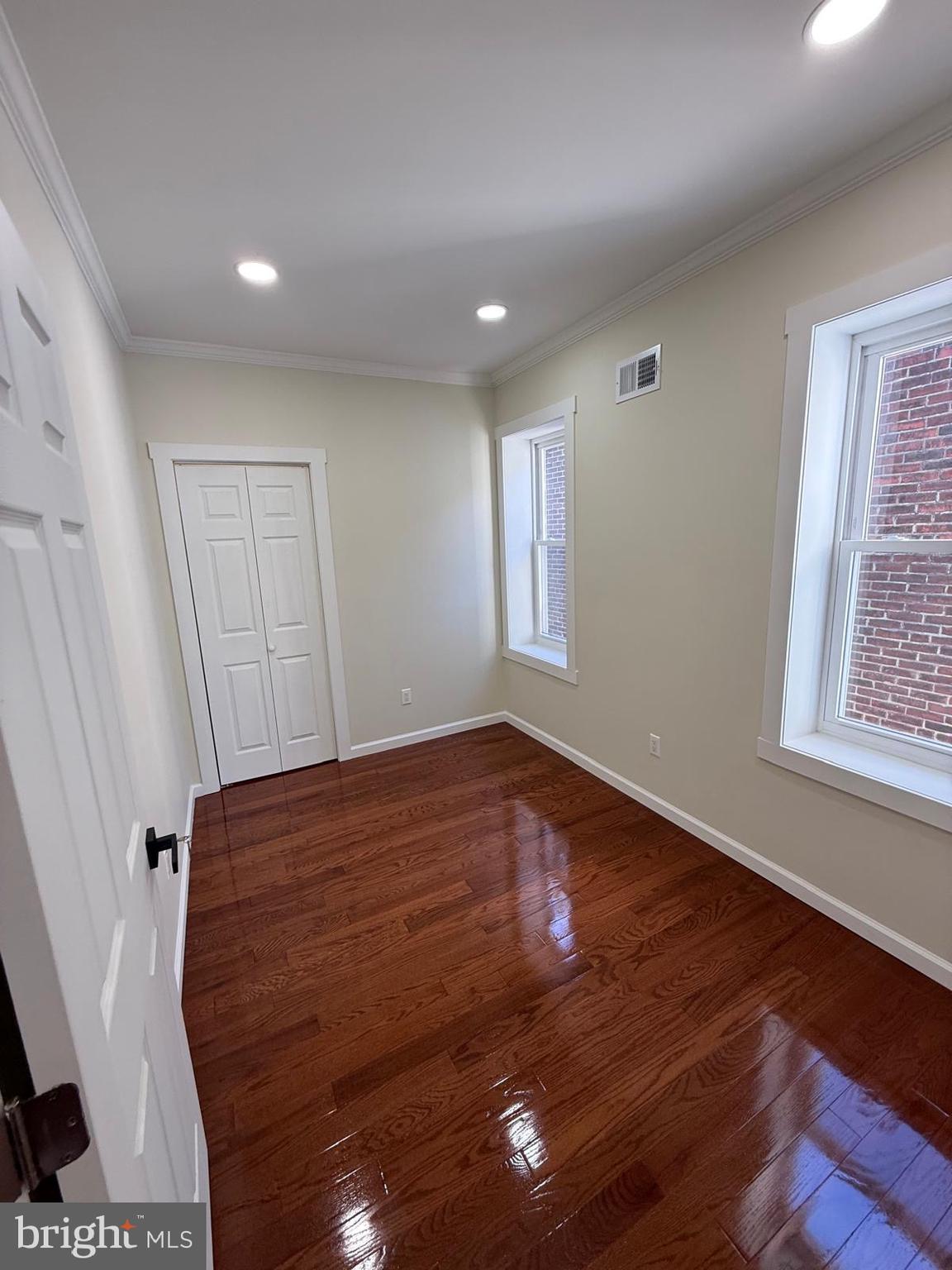 5502 Master Street Philadelphia, PA 19131 - Photo 60 of 63 a view of empty room with window and wooden floor