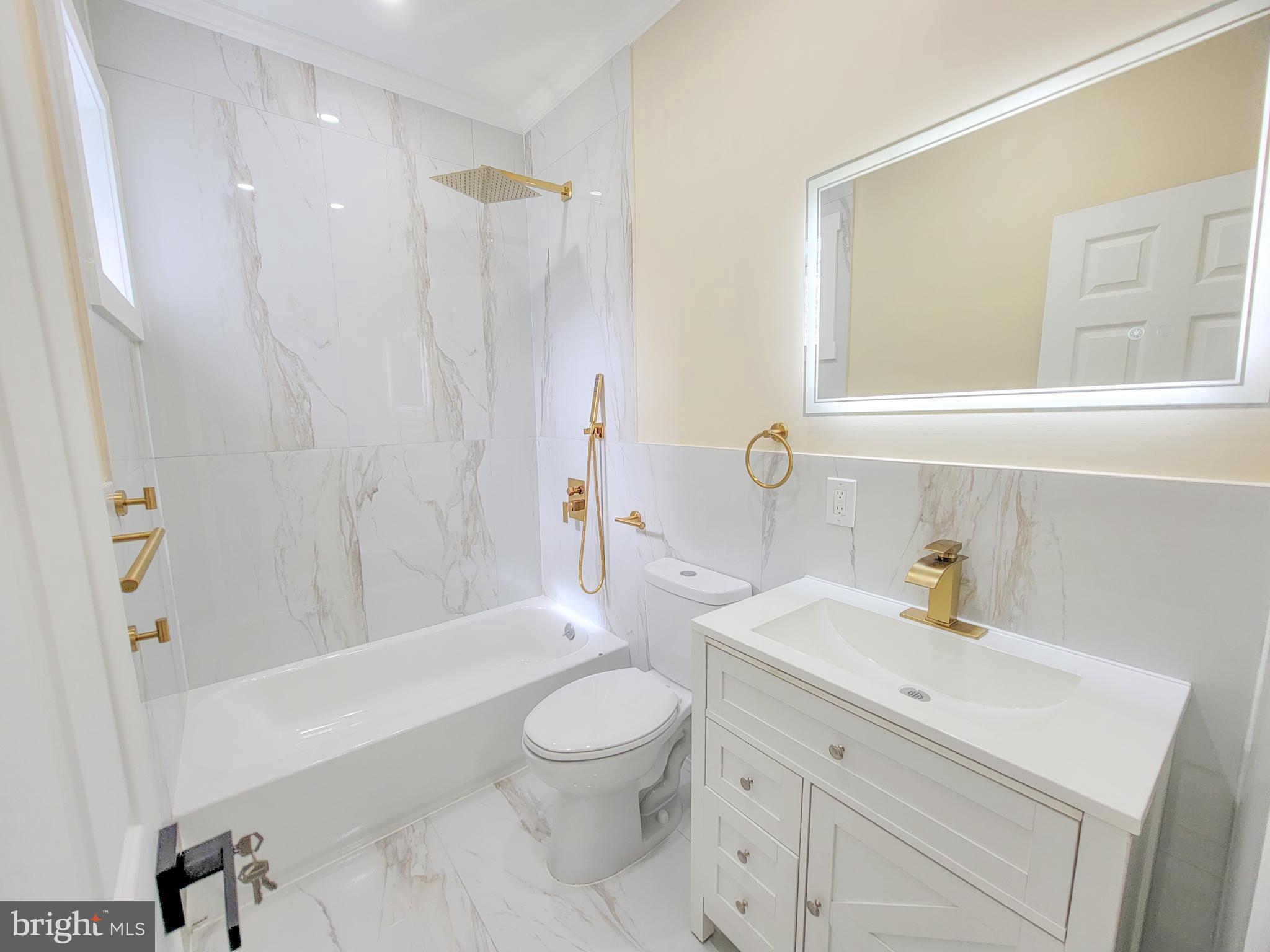 5502 Master Street Philadelphia, PA 19131 - Photo 8 of 63 a bathroom with a sink a toilet and shower