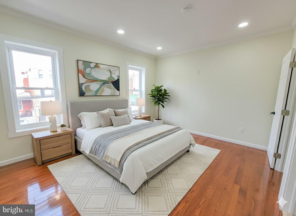 5502 Master Street Philadelphia, PA 19131 - Photo 9 of 63 a bedroom with a large bed and a painting on the wall