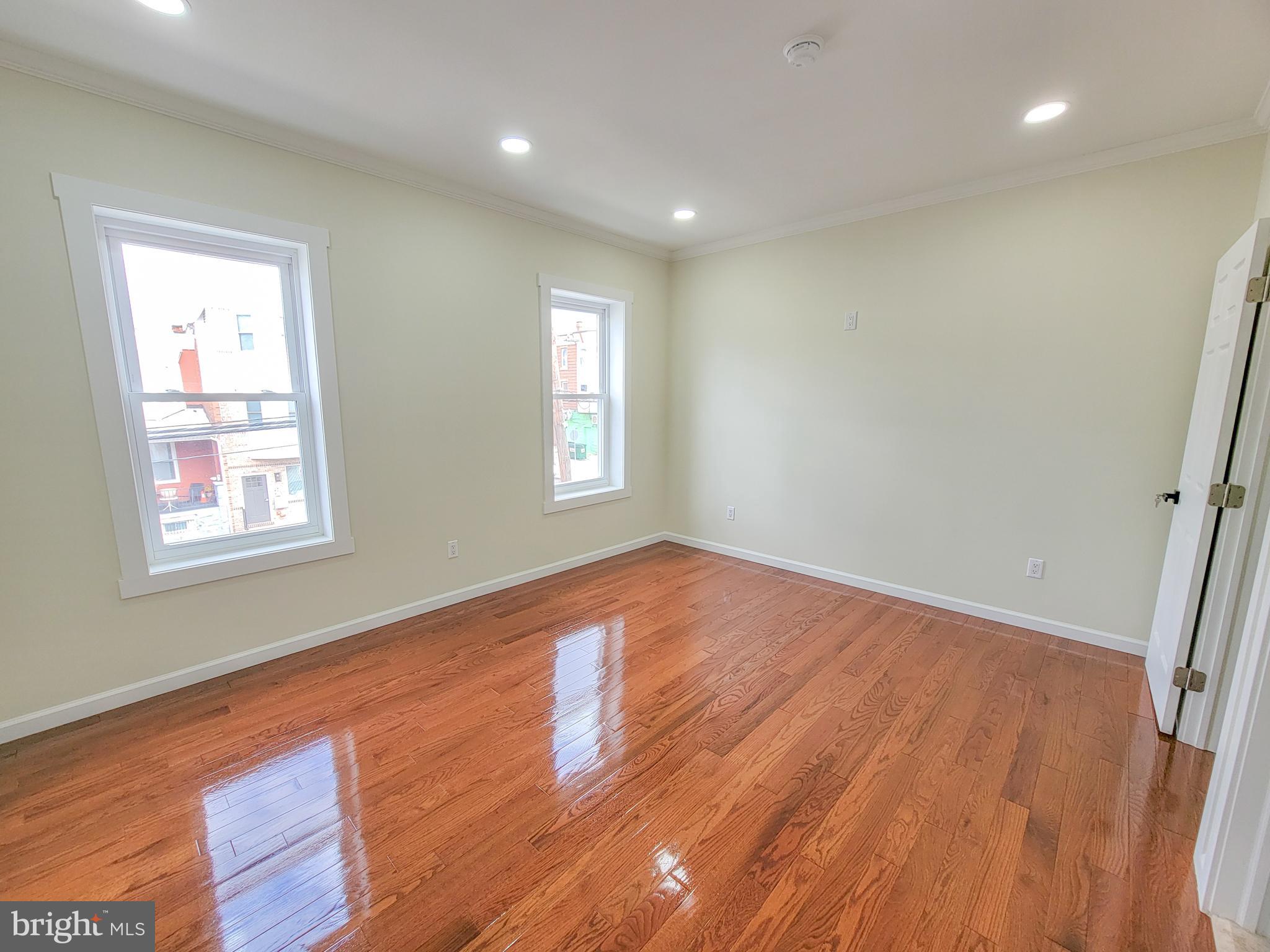 5502 Master Street Philadelphia, PA 19131 - Photo 10 of 63 an empty room with wooden floor and windows