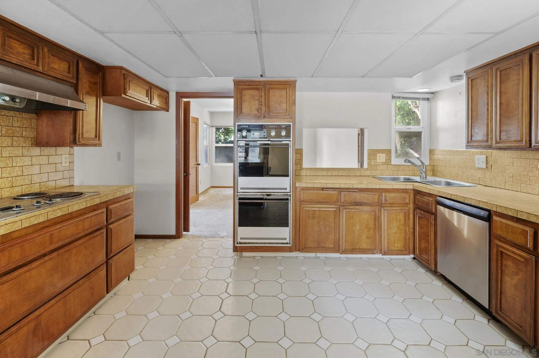 2029 Del Mar Heights Road Del Mar, CA 92014 - Photo 8 of 51 a kitchen with stainless steel appliances granite countertop a stove sink and cabinets