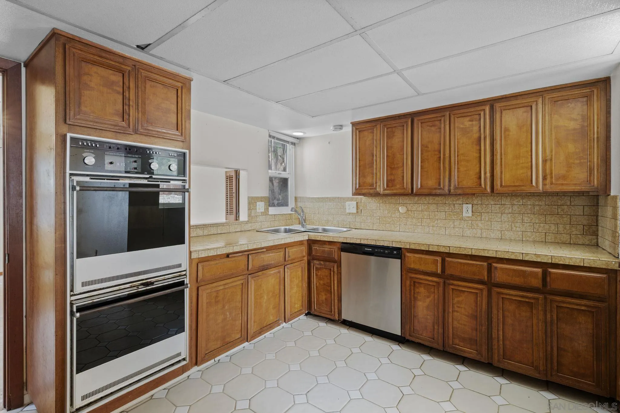 2029 Del Mar Heights Road Del Mar, CA 92014 - Photo 10 of 51 a kitchen with granite countertop stainless steel appliances and cabinets