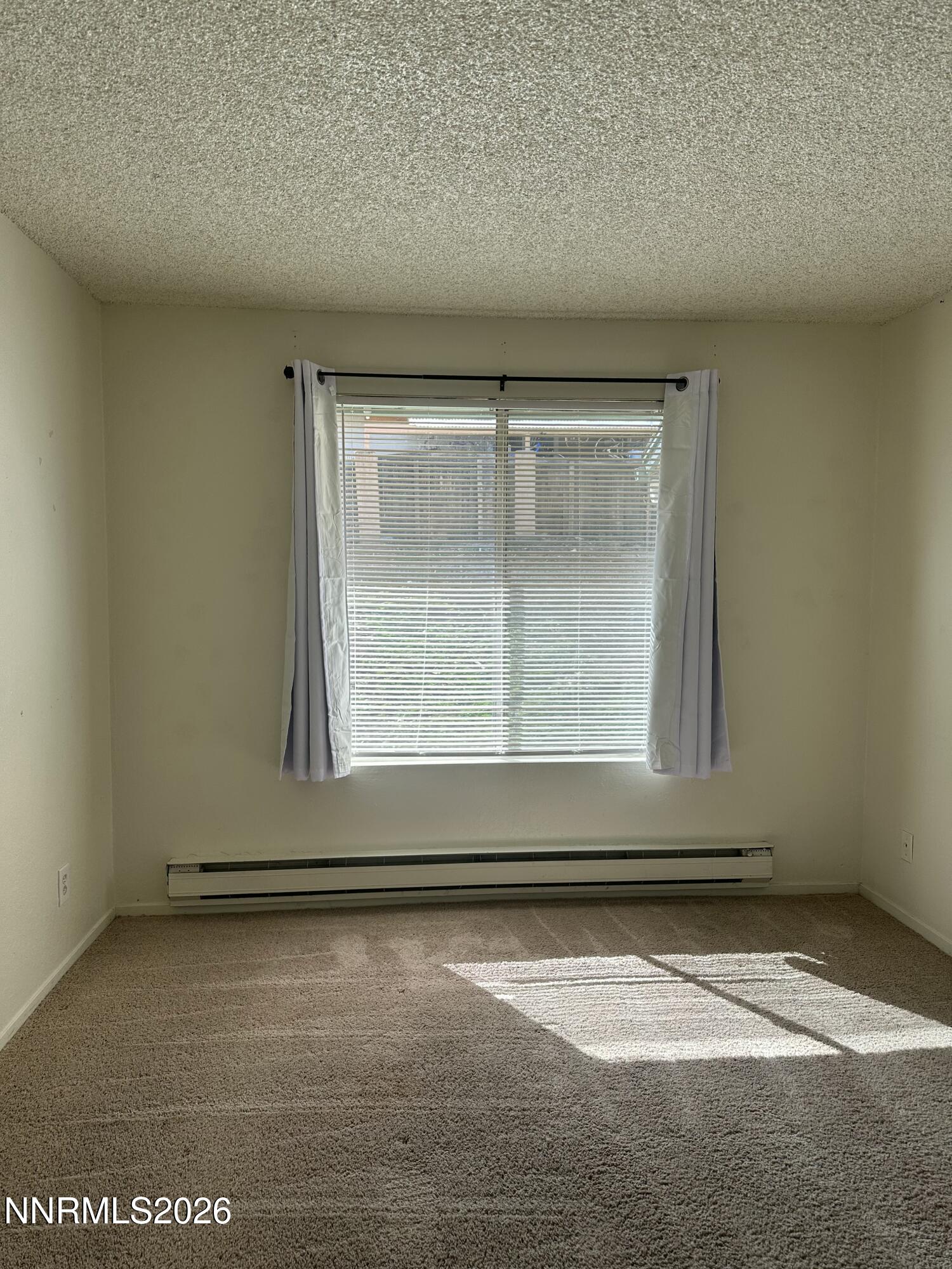 3928 Clear Acre Lane, Unit 116 Reno, NV 89512 - Photo 11 of 12 a view of a room that has a window