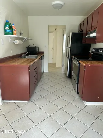 a kitchen that has a sink and a stove